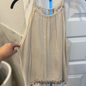 Cream top with colorful ruffles on bottom! Medium.